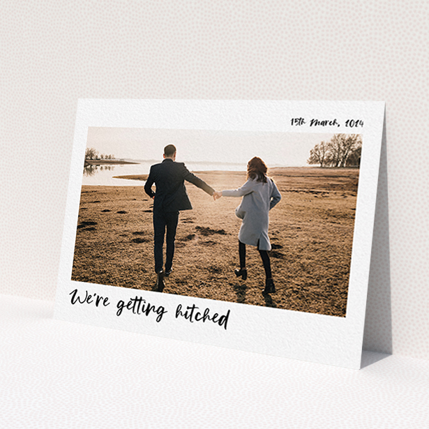 A wedding save the date card design called 'Top and Bottom Photo'. It is an A6 card in a landscape orientation. It is a photographic wedding save the date card with room for 1 photo. 'Top and Bottom Photo' is available as a flat card, with mainly white colouring.