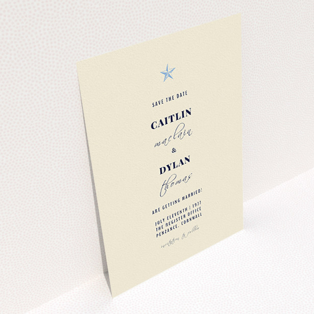 A wedding save the date design named "North Star". It is an A5 save the date in a portrait orientation. "North Star" is available as a flat save the date, with mainly dark cream colouring.