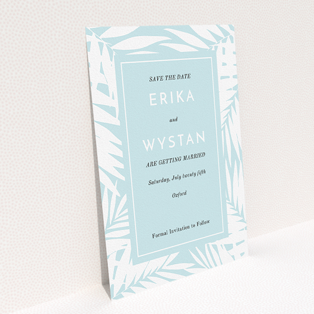 A wedding save the date template titled "Pastel Jungle". It is an A5 save the date in a portrait orientation. "Pastel Jungle" is available as a flat save the date, with tones of blue and white.
