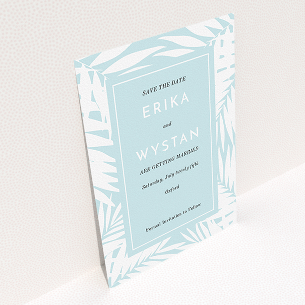 A wedding save the date template titled "Pastel Jungle". It is an A5 save the date in a portrait orientation. "Pastel Jungle" is available as a flat save the date, with tones of blue and white.