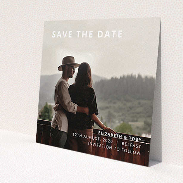 A wedding save the date design called 'Sans Serif'. It is a square (148mm x 148mm) save the date in a square orientation. It is a photographic wedding save the date with room for 1 photo. 'Sans Serif' is available as a flat save the date, with mainly white colouring.
