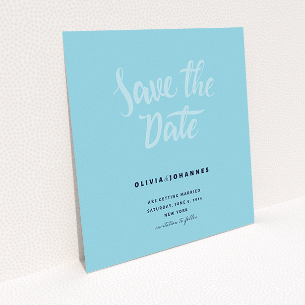 A wedding save the date called "Sky on Blue Typography". It is a square (148mm x 148mm) save the date in a square orientation. "Sky on Blue Typography" is available as a flat save the date, with mainly blue colouring.