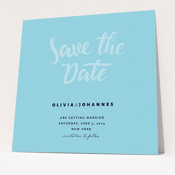 A wedding save the date called "Sky on Blue Typography". It is a square (148mm x 148mm) save the date in a square orientation. "Sky on Blue Typography" is available as a flat save the date, with mainly blue colouring.