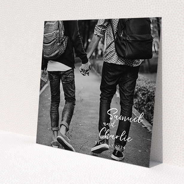 A wedding save the date named 'Soho Script'. It is a square (148mm x 148mm) save the date in a square orientation. It is a photographic wedding save the date with room for 1 photo. 'Soho Script' is available as a flat save the date, with mainly white colouring.