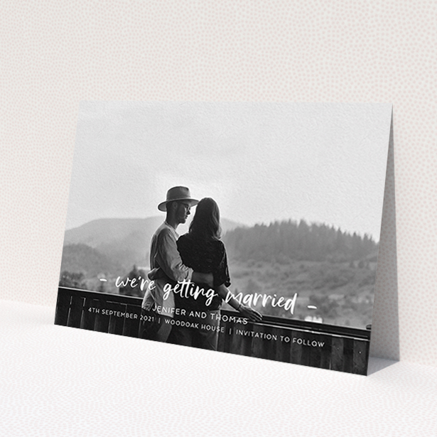 A wedding save the date called 'To the Point'. It is an A6 save the date in a landscape orientation. It is a photographic wedding save the date with room for 1 photo. 'To the Point' is available as a flat save the date, with mainly white colouring.