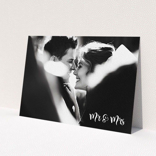 A wedding thank you card design called 'Black and White'. It is an A6 card in a landscape orientation. It is a photographic wedding thank you card with room for 1 photo. 'Black and White' is available as a flat card, with mainly white colouring.