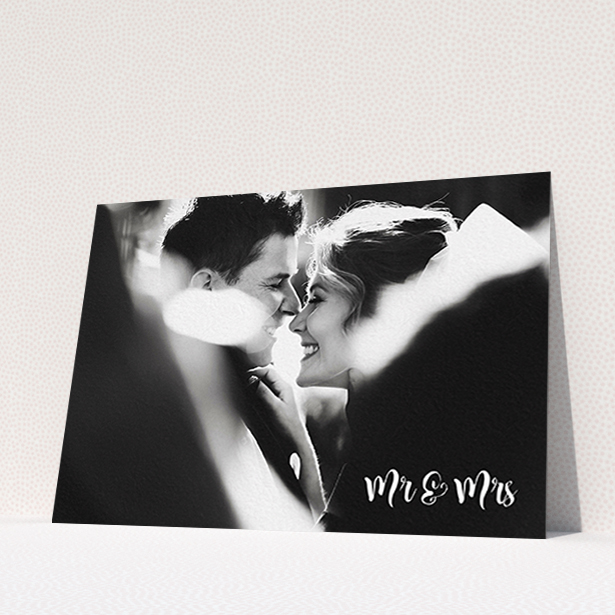 A wedding thank you card design called "Black and White". It is an A6 card in a landscape orientation. It is a photographic wedding thank you card with room for 1 photo. "Black and White" is available as a flat card, with mainly white colouring.