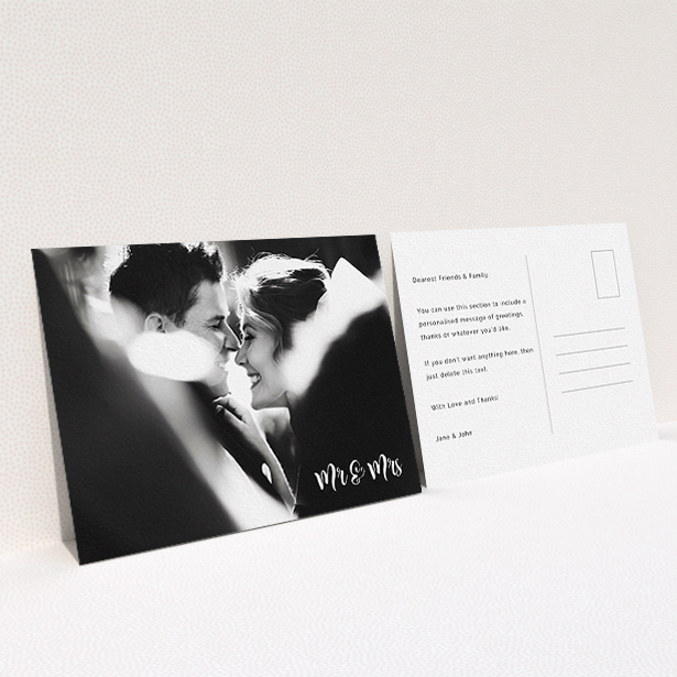 A wedding thank you card design called "Black and White". It is an A6 card in a landscape orientation. It is a photographic wedding thank you card with room for 1 photo. "Black and White" is available as a flat card, with mainly white colouring.