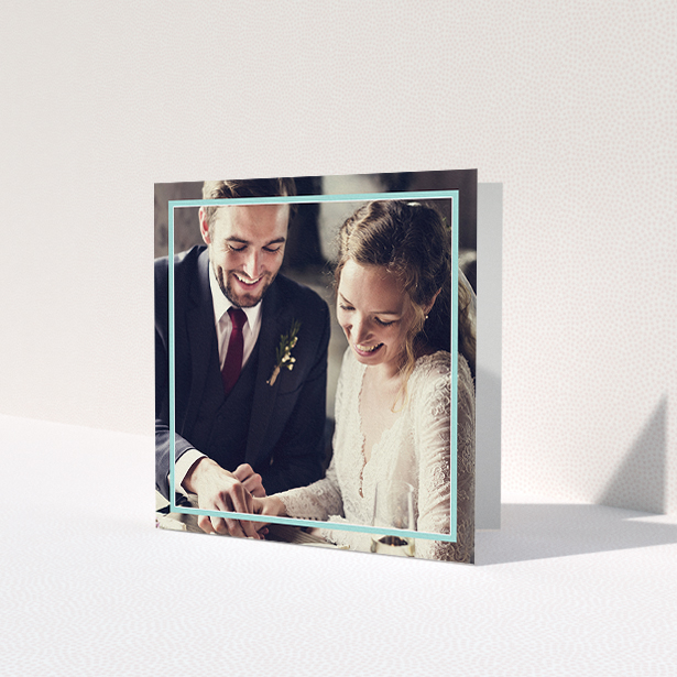 A wedding thank you card called 'Blue White Photo Frame'. It is a square (148mm x 148mm) card in a square orientation. It is a photographic wedding thank you card with room for 1 photo. 'Blue White Photo Frame' is available as a folded card, with mainly blue colouring.