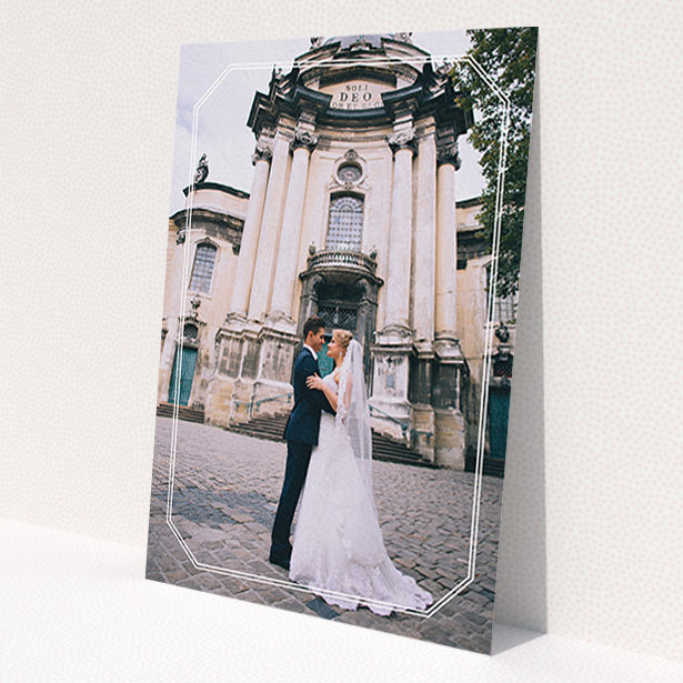 A wedding thank you card design called 'Chiselled border'. It is an A6 card in a portrait orientation. It is a photographic wedding thank you card with room for 1 photo. 'Chiselled border' is available as a flat card, with mainly white colouring.