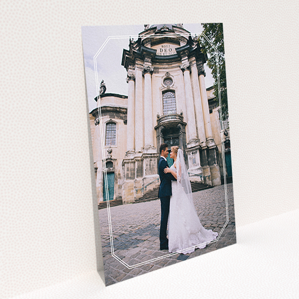 A wedding thank you card design called "Chiselled border". It is an A6 card in a portrait orientation. It is a photographic wedding thank you card with room for 1 photo. "Chiselled border" is available as a flat card, with mainly white colouring.