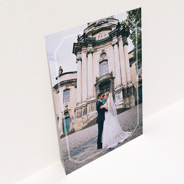 A wedding thank you card design called "Chiselled border". It is an A6 card in a portrait orientation. It is a photographic wedding thank you card with room for 1 photo. "Chiselled border" is available as a flat card, with mainly white colouring.