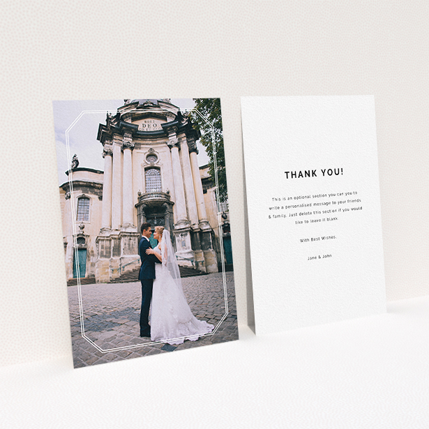 A wedding thank you card design called "Chiselled border". It is an A6 card in a portrait orientation. It is a photographic wedding thank you card with room for 1 photo. "Chiselled border" is available as a flat card, with mainly white colouring.