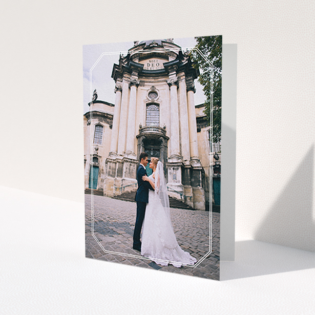 A wedding thank you card design titled 'Chiselled border'. It is an A6 card in a portrait orientation. It is a photographic wedding thank you card with room for 1 photo. 'Chiselled border' is available as a folded card, with mainly white colouring.