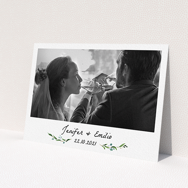 A wedding thank you card design named 'Classic Floral'. It is an A6 card in a landscape orientation. It is a photographic wedding thank you card with room for 1 photo. 'Classic Floral' is available as a flat card, with tones of green and white.