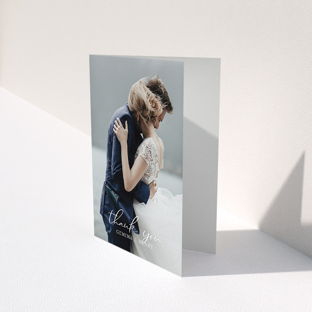 A wedding thank you card template titled "Classic Thank You". It is an A6 card in a portrait orientation. It is a photographic wedding thank you card with room for 1 photo. "Classic Thank You" is available as a folded card, with mainly white colouring.