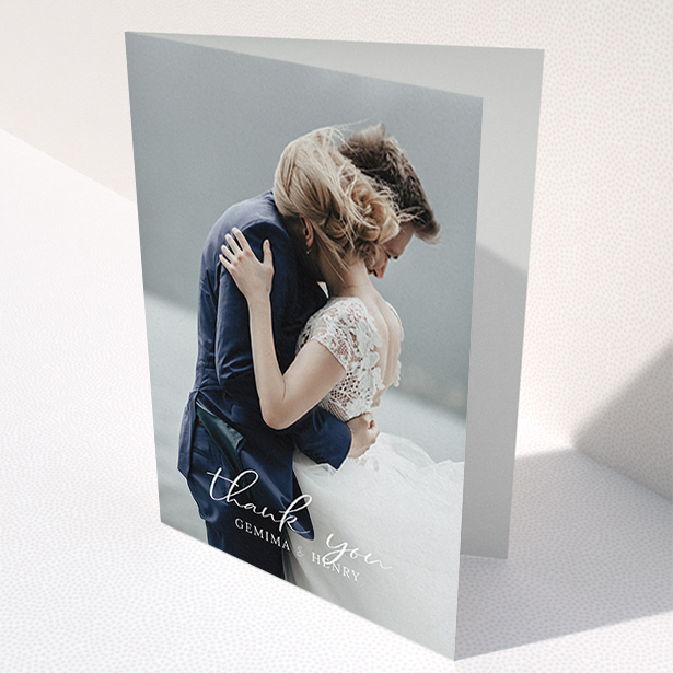 A wedding thank you card template titled "Classic Thank You". It is an A6 card in a portrait orientation. It is a photographic wedding thank you card with room for 1 photo. "Classic Thank You" is available as a folded card, with mainly white colouring.
