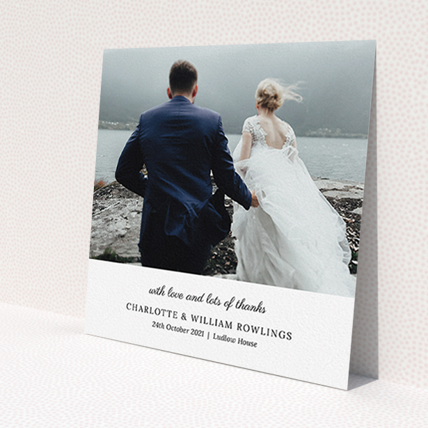 A wedding thank you card design titled 'Classic Wedding Thanks'. It is a square (148mm x 148mm) card in a square orientation. It is a photographic wedding thank you card with room for 1 photo. 'Classic Wedding Thanks' is available as a flat card, with mainly white colouring.