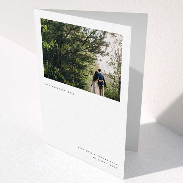 A wedding thank you card design titled "Modern Postcard". It is an A6 card in a portrait orientation. It is a photographic wedding thank you card with room for 1 photo. "Modern Postcard" is available as a folded card, with mainly white colouring.
