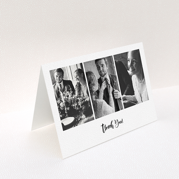 A wedding thank you card named "Modern Tryptic". It is an A6 card in a landscape orientation. It is a photographic wedding thank you card with room for 3 photos. "Modern Tryptic" is available as a folded card, with mainly white colouring.