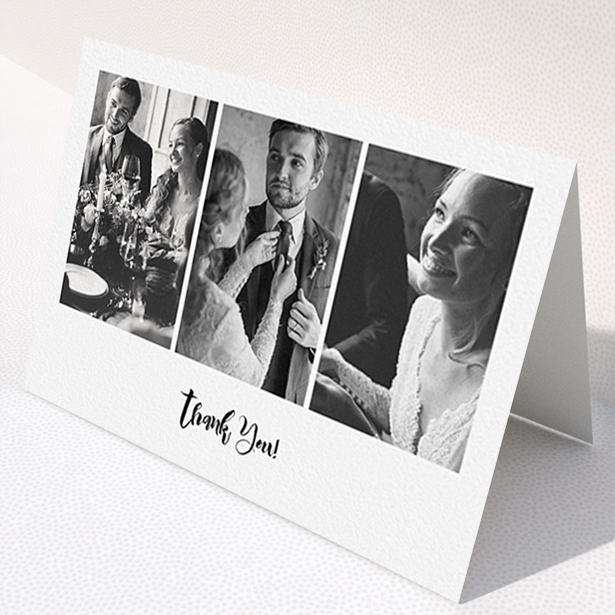 A wedding thank you card named "Modern Tryptic". It is an A6 card in a landscape orientation. It is a photographic wedding thank you card with room for 3 photos. "Modern Tryptic" is available as a folded card, with mainly white colouring.