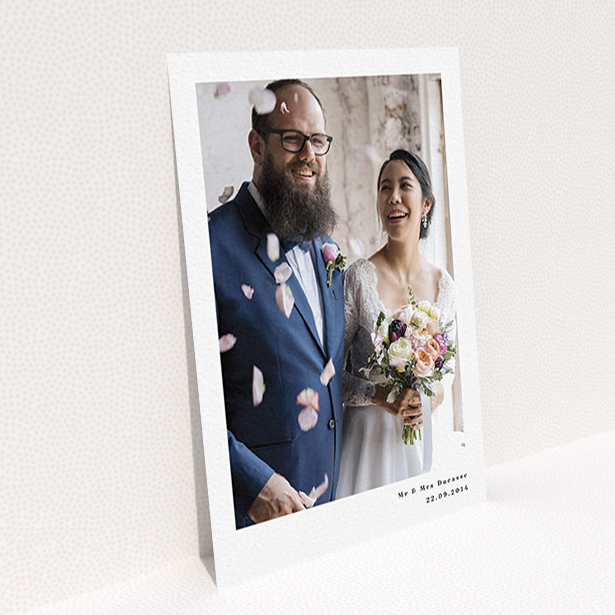 A wedding thank you card called "Most of the page". It is an A6 card in a portrait orientation. It is a photographic wedding thank you card with room for 1 photo. "Most of the page" is available as a flat card, with mainly white colouring.