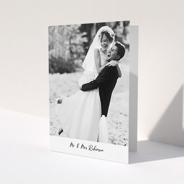 A wedding thank you card design called 'Mr & Mrs Footer'. It is an A6 card in a portrait orientation. It is a photographic wedding thank you card with room for 1 photo. 'Mr & Mrs Footer' is available as a folded card, with mainly white colouring.