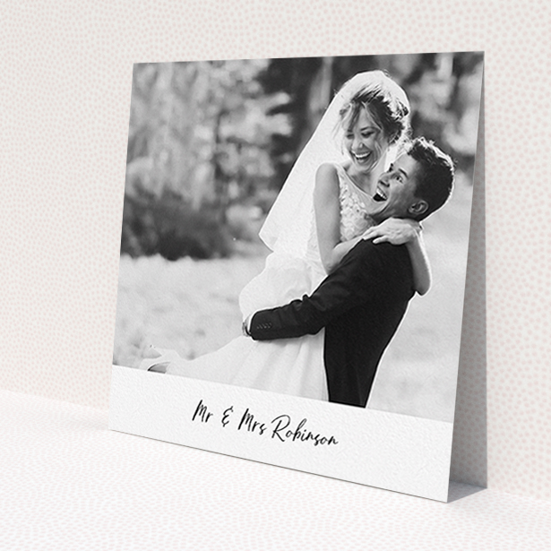 A wedding thank you card template titled 'Mr & Mrs Footer'. It is a square (148mm x 148mm) card in a square orientation. It is a photographic wedding thank you card with room for 1 photo. 'Mr & Mrs Footer' is available as a flat card, with mainly white colouring.