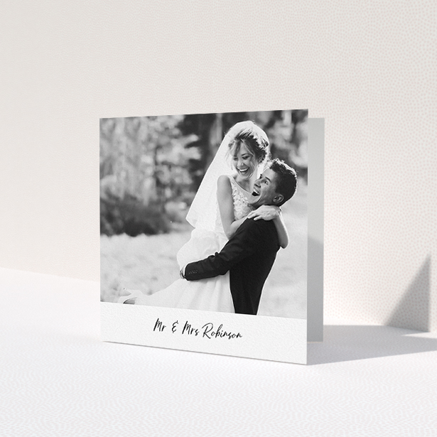 A wedding thank you card design called 'Mr & Mrs Footer'. It is a square (148mm x 148mm) card in a square orientation. It is a photographic wedding thank you card with room for 1 photo. 'Mr & Mrs Footer' is available as a folded card, with mainly white colouring.