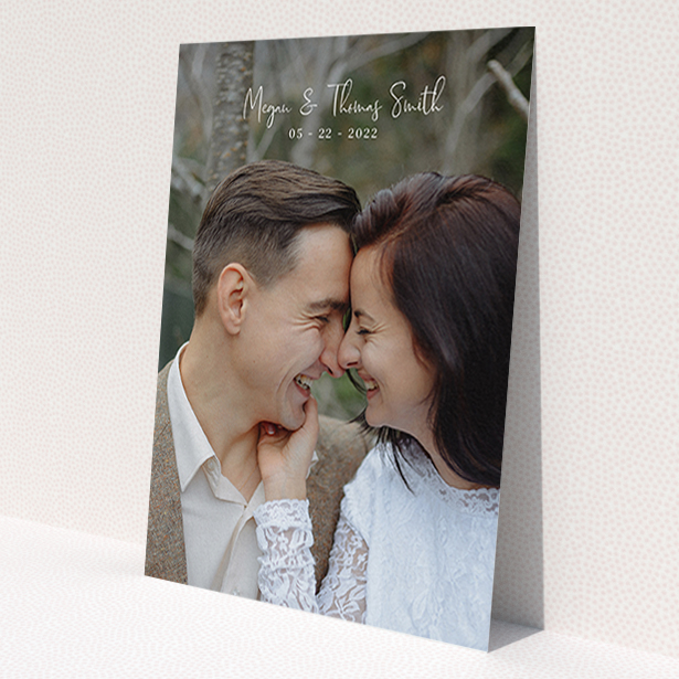 A wedding thank you card called 'Name-Date-Photo'. It is an A6 card in a portrait orientation. It is a photographic wedding thank you card with room for 1 photo. 'Name-Date-Photo' is available as a flat card, with mainly white colouring.
