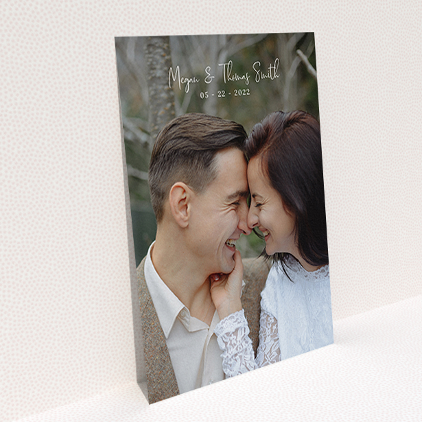 A wedding thank you card called "Name-Date-Photo". It is an A6 card in a portrait orientation. It is a photographic wedding thank you card with room for 1 photo. "Name-Date-Photo" is available as a flat card, with mainly white colouring.