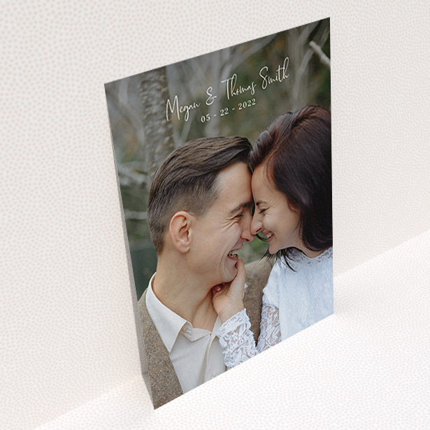 A wedding thank you card called "Name-Date-Photo". It is an A6 card in a portrait orientation. It is a photographic wedding thank you card with room for 1 photo. "Name-Date-Photo" is available as a flat card, with mainly white colouring.