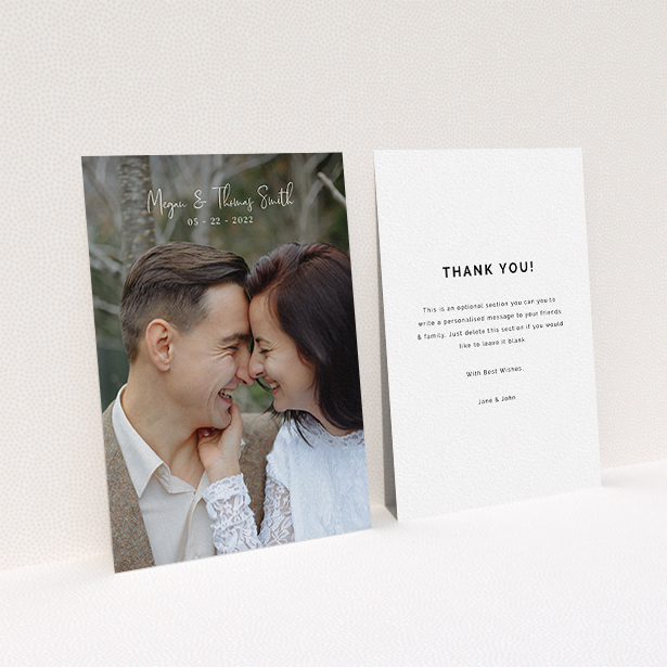 A wedding thank you card called "Name-Date-Photo". It is an A6 card in a portrait orientation. It is a photographic wedding thank you card with room for 1 photo. "Name-Date-Photo" is available as a flat card, with mainly white colouring.