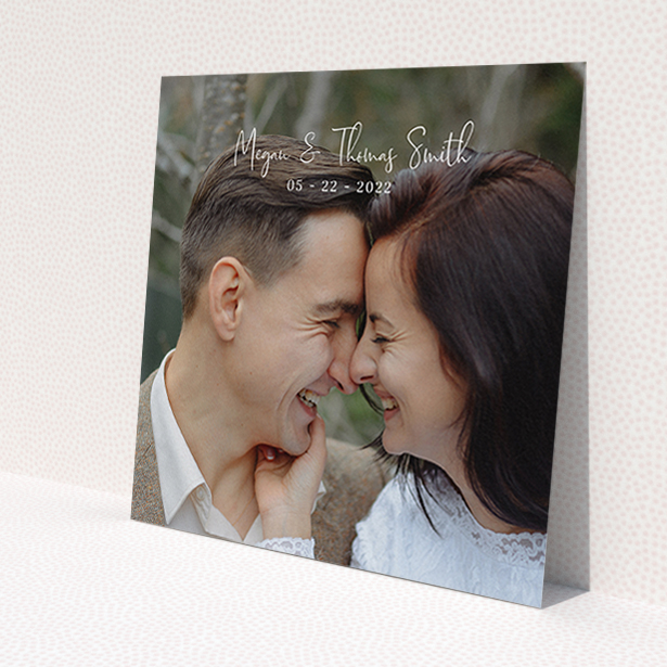 A wedding thank you card design called 'Name-Date-Photo'. It is a square (148mm x 148mm) card in a square orientation. It is a photographic wedding thank you card with room for 1 photo. 'Name-Date-Photo' is available as a flat card, with mainly white colouring.