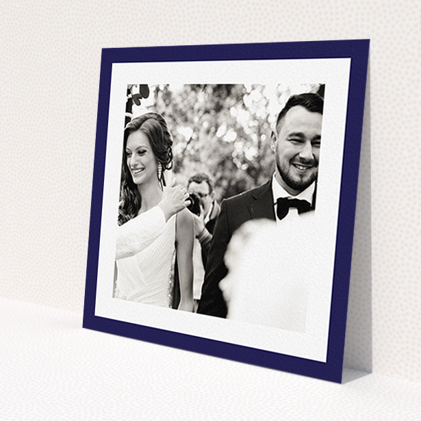 A wedding thank you card called 'Navy Border'. It is a square (148mm x 148mm) card in a square orientation. It is a photographic wedding thank you card with room for 1 photo. 'Navy Border' is available as a flat card, with tones of blue and white.