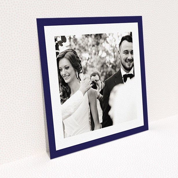 A wedding thank you card called "Navy Border". It is a square (148mm x 148mm) card in a square orientation. It is a photographic wedding thank you card with room for 1 photo. "Navy Border" is available as a flat card, with tones of blue and white.