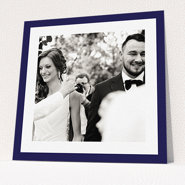 A wedding thank you card called "Navy Border". It is a square (148mm x 148mm) card in a square orientation. It is a photographic wedding thank you card with room for 1 photo. "Navy Border" is available as a flat card, with tones of blue and white.