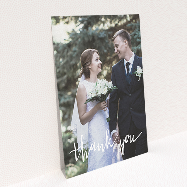 A wedding thank you card called "New to calligraphy". It is an A6 card in a portrait orientation. It is a photographic wedding thank you card with room for 1 photo. "New to calligraphy" is available as a flat card, with mainly white colouring.