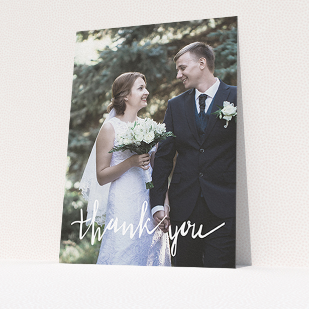 A wedding thank you card called "New to calligraphy". It is an A6 card in a portrait orientation. It is a photographic wedding thank you card with room for 1 photo. "New to calligraphy" is available as a flat card, with mainly white colouring.