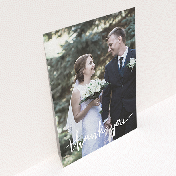 A wedding thank you card called "New to calligraphy". It is an A6 card in a portrait orientation. It is a photographic wedding thank you card with room for 1 photo. "New to calligraphy" is available as a flat card, with mainly white colouring.