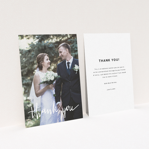 A wedding thank you card called "New to calligraphy". It is an A6 card in a portrait orientation. It is a photographic wedding thank you card with room for 1 photo. "New to calligraphy" is available as a flat card, with mainly white colouring.