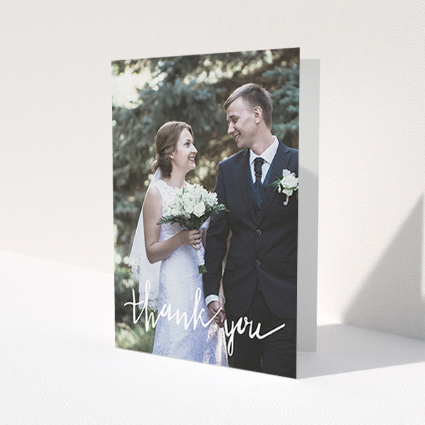 A wedding thank you card template titled 'New to calligraphy'. It is an A6 card in a portrait orientation. It is a photographic wedding thank you card with room for 1 photo. 'New to calligraphy' is available as a folded card, with mainly white colouring.