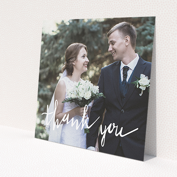 A wedding thank you card template titled 'New to calligraphy'. It is a square (148mm x 148mm) card in a square orientation. It is a photographic wedding thank you card with room for 1 photo. 'New to calligraphy' is available as a flat card, with mainly white colouring.