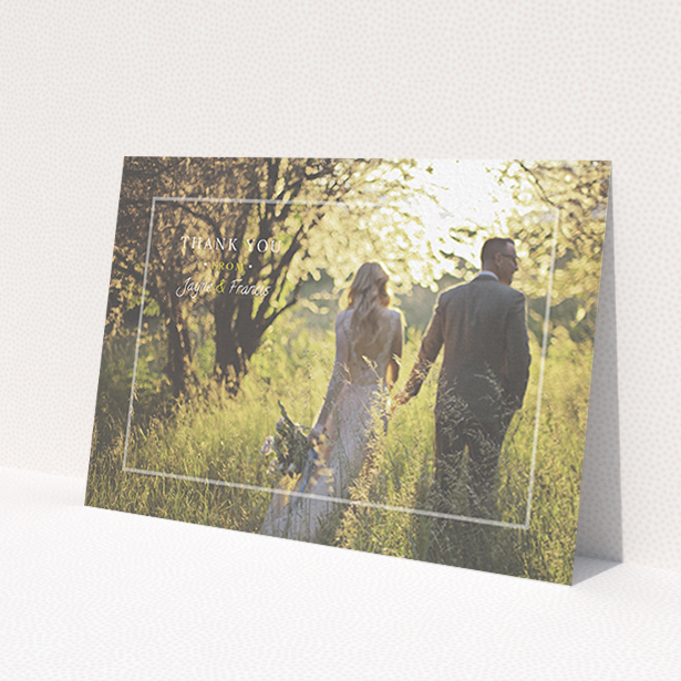 A wedding thank you card design called 'Not even there'. It is an A6 card in a landscape orientation. It is a photographic wedding thank you card with room for 1 photo. 'Not even there' is available as a flat card, with mainly white colouring.