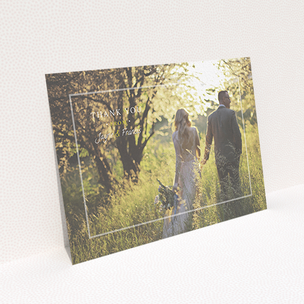 A wedding thank you card design called "Not even there". It is an A6 card in a landscape orientation. It is a photographic wedding thank you card with room for 1 photo. "Not even there" is available as a flat card, with mainly white colouring.