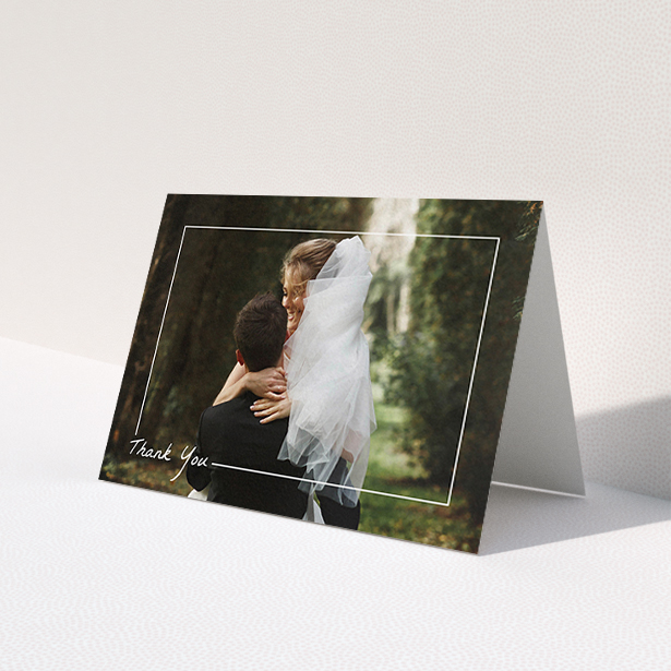 A wedding thank you card template titled 'On Photo Border'. It is an A6 card in a landscape orientation. It is a photographic wedding thank you card with room for 1 photo. 'On Photo Border' is available as a folded card, with mainly white colouring.