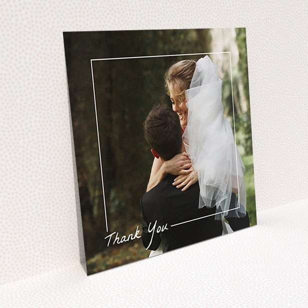 A wedding thank you card named "On Photo Border". It is a square (148mm x 148mm) card in a square orientation. It is a photographic wedding thank you card with room for 1 photo. "On Photo Border" is available as a flat card, with mainly white colouring.