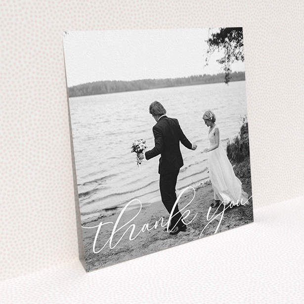 A wedding thank you card design named "One Photo". It is a square (148mm x 148mm) card in a square orientation. It is a photographic wedding thank you card with room for 1 photo. "One Photo" is available as a flat card, with mainly white colouring.