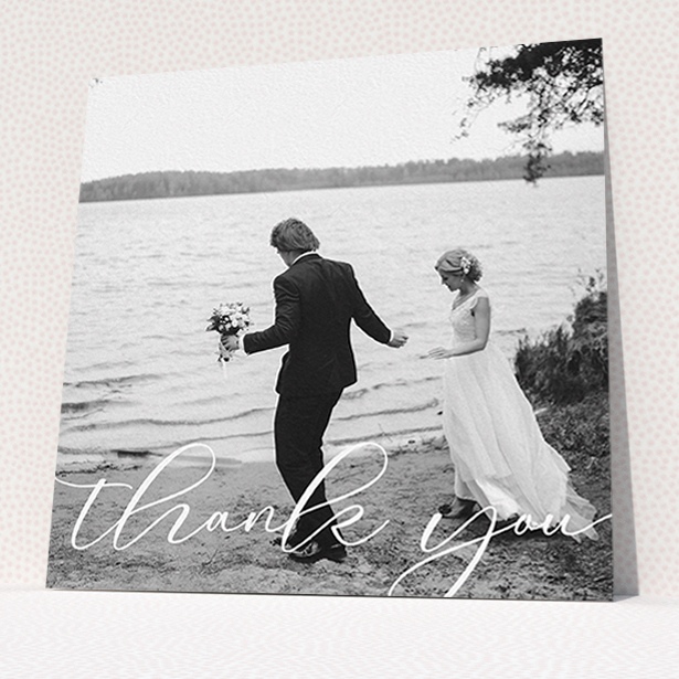 A wedding thank you card design named "One Photo". It is a square (148mm x 148mm) card in a square orientation. It is a photographic wedding thank you card with room for 1 photo. "One Photo" is available as a flat card, with mainly white colouring.