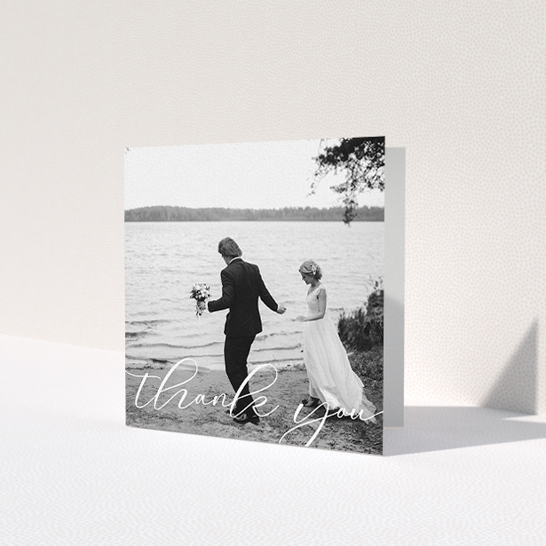 A wedding thank you card design titled 'One Photo'. It is a square (148mm x 148mm) card in a square orientation. It is a photographic wedding thank you card with room for 1 photo. 'One Photo' is available as a folded card, with mainly white colouring.
